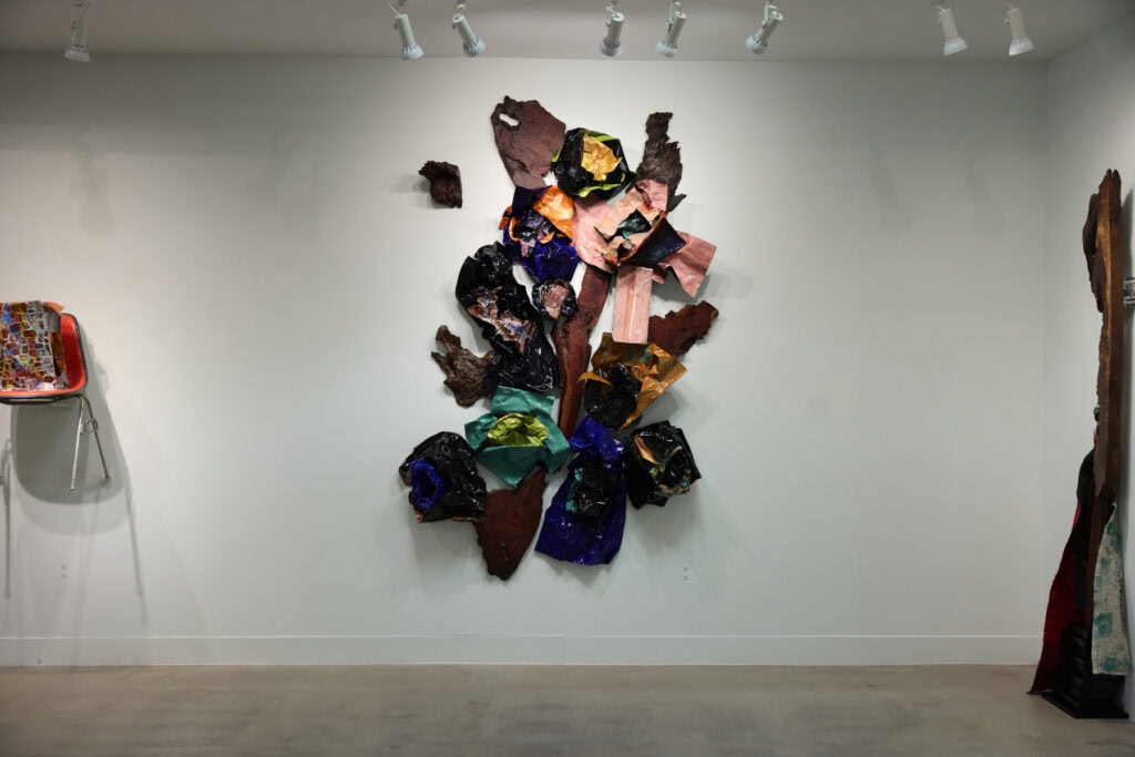 What We Carry by Christi Meril, Seventeen hand-cut paper sculptures cast in resin, with old-growth redwood, The Long Journey Home, ALG Fine Art Dallas