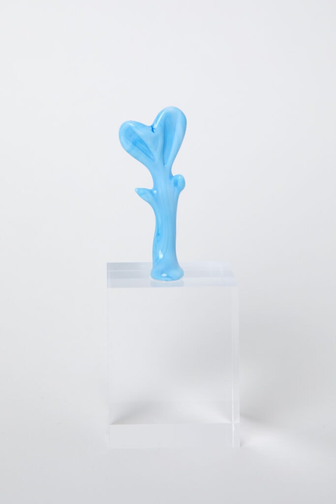 Fused glass 'hug' sculpture in sky blue glass