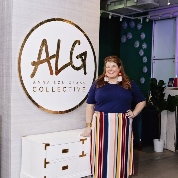 Anna with gallery sign